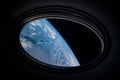 Porthole of spaceship in the outer space, bull\'s-eye window from spacecraft. Elements of this image furnished by NASA Royalty Free Stock Photo