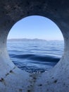 Porthole View While Sailing in Greece