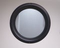 Porthole window with black frame and translucent glass reinforce Royalty Free Stock Photo