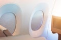 Portholes with the curtain down for sun protection during the flight for the passenger of the aircraft