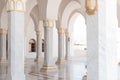 Portico of El Salam Mosque with white columns and arches