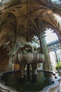 portico with a fountain in a courtyard of an ancient portugal monastery