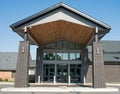 Contemporary Church Portico with Wooden Ceiling and Brick Pillars