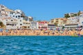 PORTIMAO, PORTUGAL - AUGUST 02, 2017: Overcrowded beach in the south of the Portuguese region Algarve