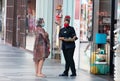 Portimao, Portugal - July 11, 2020: Staff of perfume shop is presenting a product to a customer in Aqua Portimao shopping mall in