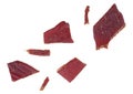 Portion of beef jerky isolated on white background. Beef jerky pieces.Dried peppered beef jerky slices Royalty Free Stock Photo