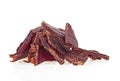 Portion of beef jerky on white white background. Full depth of field Royalty Free Stock Photo