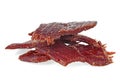 Portion of beef jerky on white white background. Full depth of field Royalty Free Stock Photo