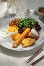 Portion of breakfast with sausage and fried eggs Royalty Free Stock Photo