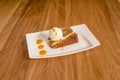 portion of carrot cake accompanied by a scoop of vanilla ice cream Royalty Free Stock Photo