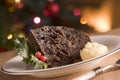 Portion of Christmas Pudding with Brandy Butter Royalty Free Stock Photo
