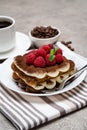 Portion of Classic tiramisu dessert with raspberries and cup of coffee and cream or milk on grey concrete background Royalty Free Stock Photo