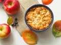 Portion of coffeecake in blue bowl. Biscuit with autumn apples. Homemade crumble pie with streusel topping.