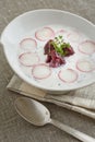 A portion of cold beet soup on a serviette