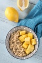 Portion of cooked quinoa with mango slices Royalty Free Stock Photo