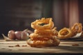 portion of crispy fried onion rings on rustic wooden table. AI generated