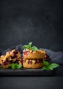 Portion crumble pie with cherries on a wooden board