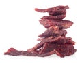 Portion of delicious beef jerky isolated on white background. Pile of dried meat Royalty Free Stock Photo