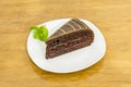 Portion of delicious chocolate cake with three layers of sponge cake Royalty Free Stock Photo