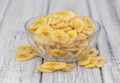 Portion of Dried Banana Chips on wooden background, selective focus Royalty Free Stock Photo