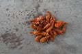 Portion of dried Vietnamese chili peppers on a gray background top view