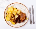 Portion of duck confit on table