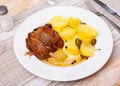 Portion of duck confit on table