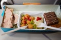 Portion of food for one passenger in cardboard box Royalty Free Stock Photo