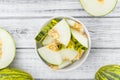 Portion of Fresh Futuro Melon on wooden background selective fo Royalty Free Stock Photo