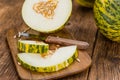 Portion of Fresh Futuro Melon on wooden background & x28;selective fo Royalty Free Stock Photo