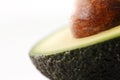 A portion of a fresh organic avocado against a white background
