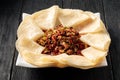 Portion of fried asian meat with tortillas