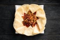 Portion of fried asian meat with tortillas