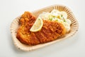 Portion of fried battered fish or German schnitzel