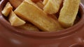 A portion of fried maniocs Mandiocas on a wooden table, traditional brazilian food