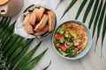 Portion of hummus bowl with fresh salad