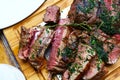 Portion of grilled beef chateaubriand with herbs