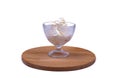 Portion of ice cream in a crystal glass on a wooden board Royalty Free Stock Photo