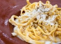 A portion of Italian traditional pasta with cacio e pepe - cheese and pepper- sauce Royalty Free Stock Photo