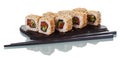 Portion of Japanese sushi rolls on special plate and chopsticks isolated on white Royalty Free Stock Photo