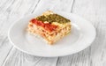 Portion of lasagne on white plate Royalty Free Stock Photo