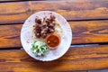 Portion luleh kebab on a plate. Appetizing dish on the wooden table