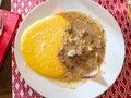 portion of Manzo all 'Olio with polenta on plate Royalty Free Stock Photo