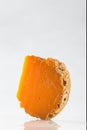 Portion of Mimolette Cheese on white background Royalty Free Stock Photo
