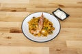 Portion of mixed rice paella with vegetables and seafood. A large prawn coddled on top of the rice and aioli sauce Royalty Free Stock Photo