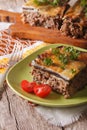 Portion of moussaka with eggplant on a plate close-up. Vertical