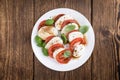 Portion of Mozarella with Tomatoes and Balsamico dressing Royalty Free Stock Photo