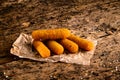 Portion of Mozzarella Sticks on an old wooden table Royalty Free Stock Photo