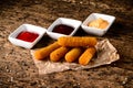 Portion of Mozzarella Sticks on an old wooden table Royalty Free Stock Photo