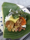 A portion of nasi gudeg, a typical Indonesian dish, especially Yogyakarta, in the form of white rice with boiled eggs